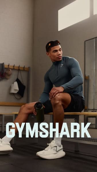 Gymshark ad, an athlete resting on a locker-room bench in training kit
