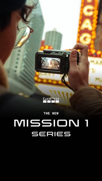 GoPro ad launching the Mission 1 series, camera held up in a city street